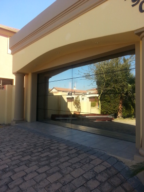 Aluminium Glass Frameless Double Garage Door Junk Mail